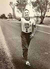 Cliff Young waving during ultra marathon 