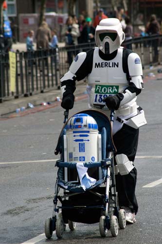 Storm trooper with R2D2 in stroller 